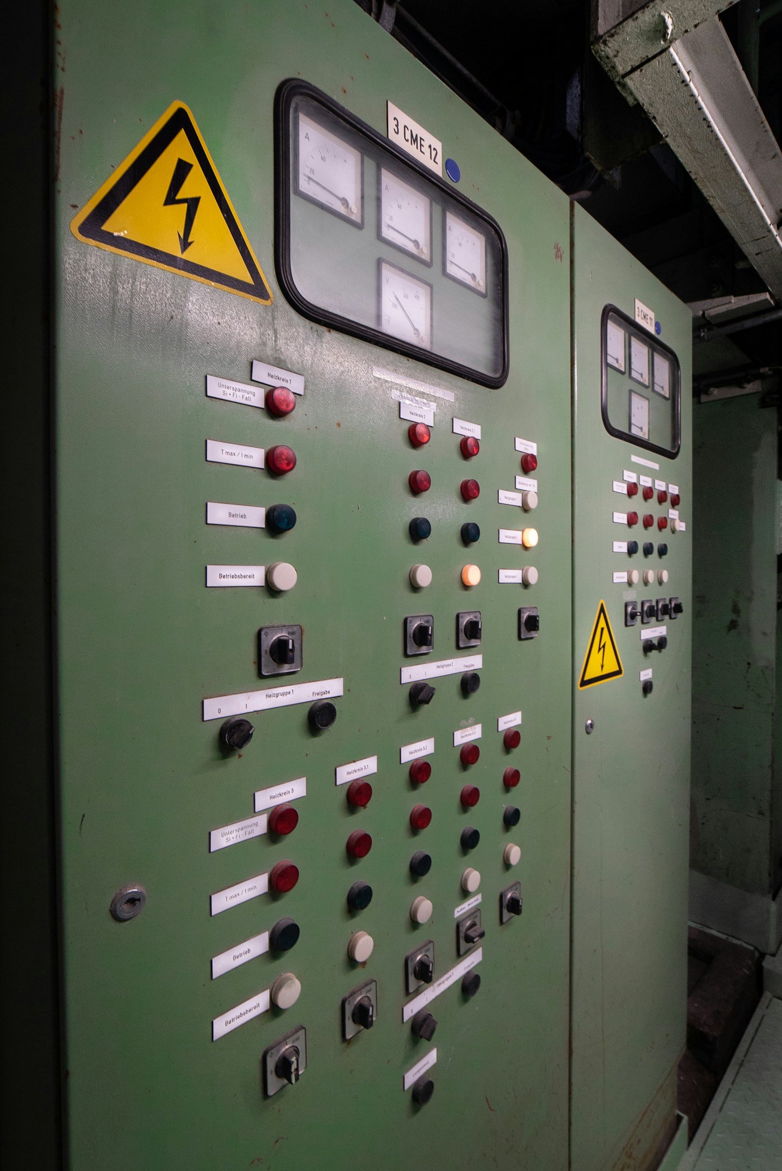 Close-up of a control cabinet with buttons and indicator lamps
