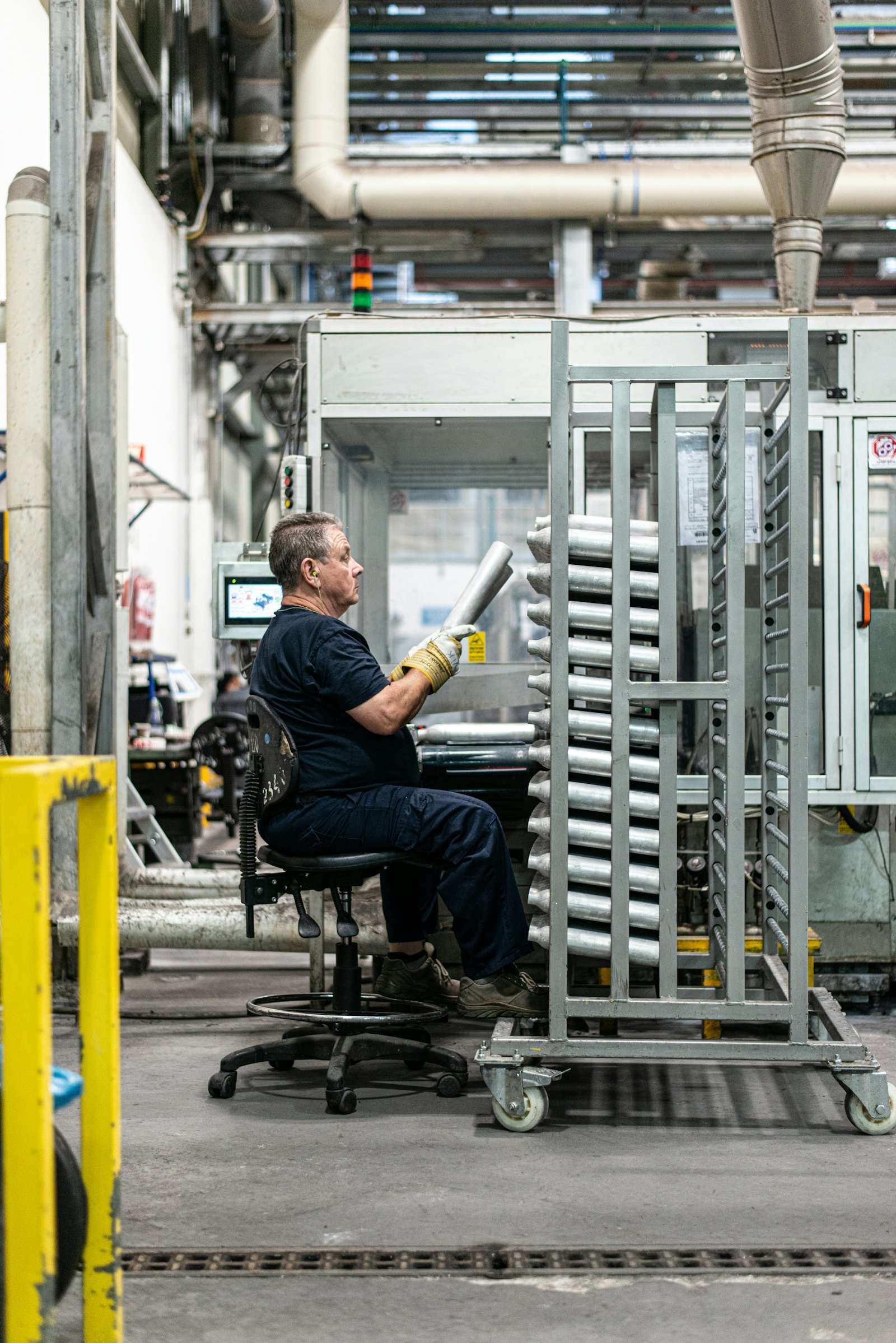 Operator working at an industrial control station