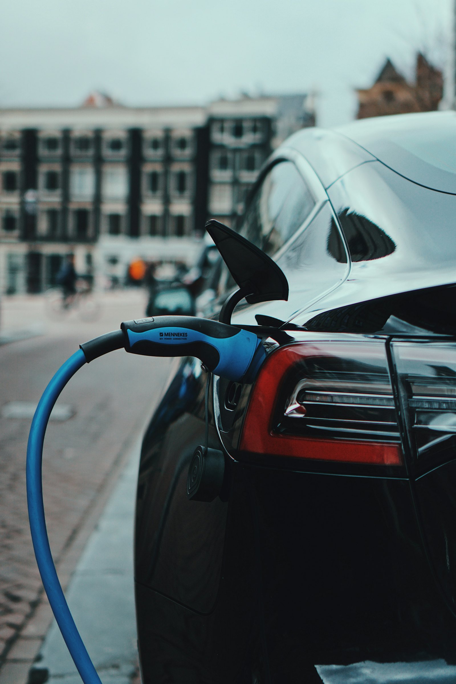 Electric car charging on a city street