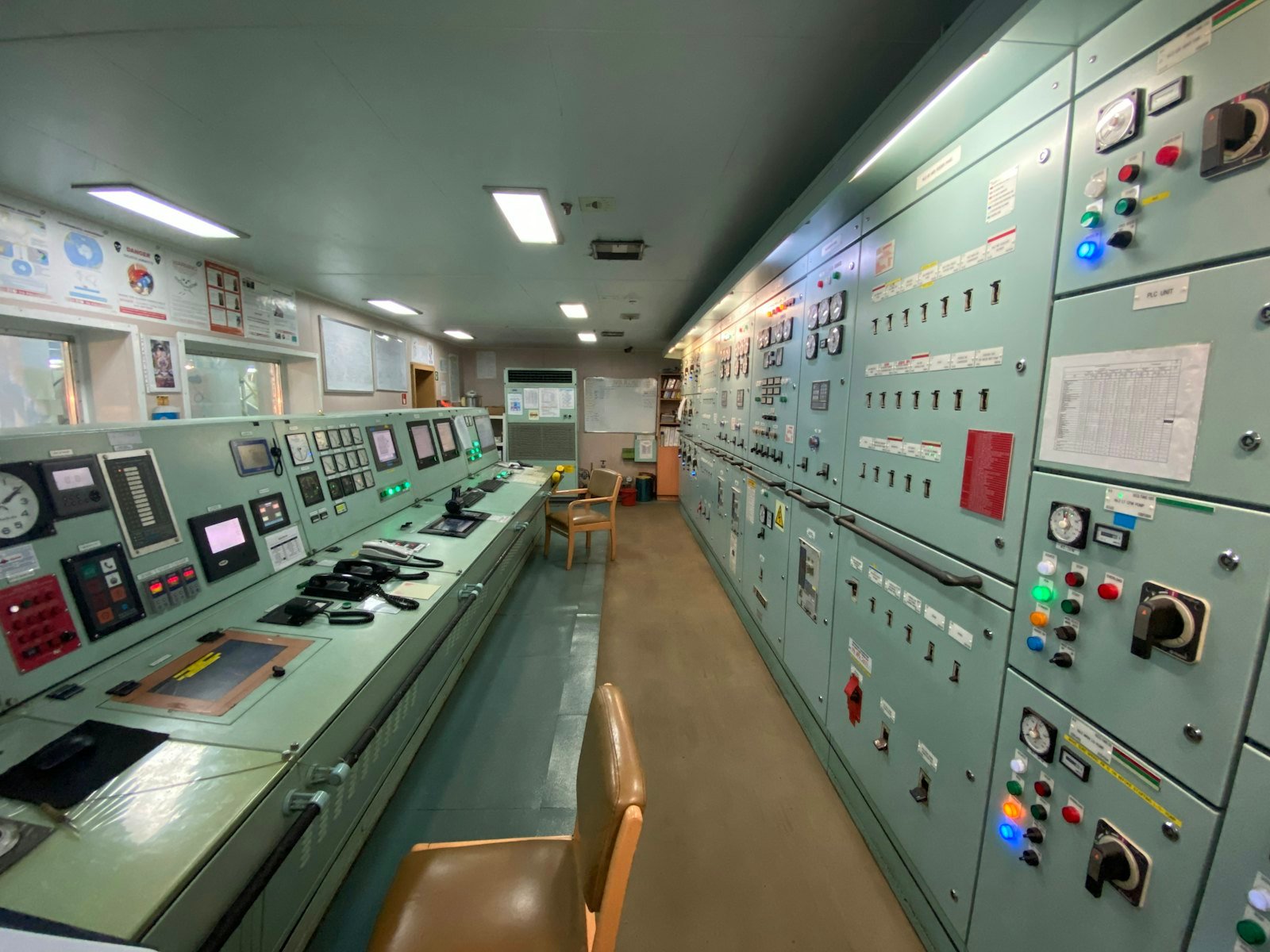 Control room with long rows of panels and buttons
