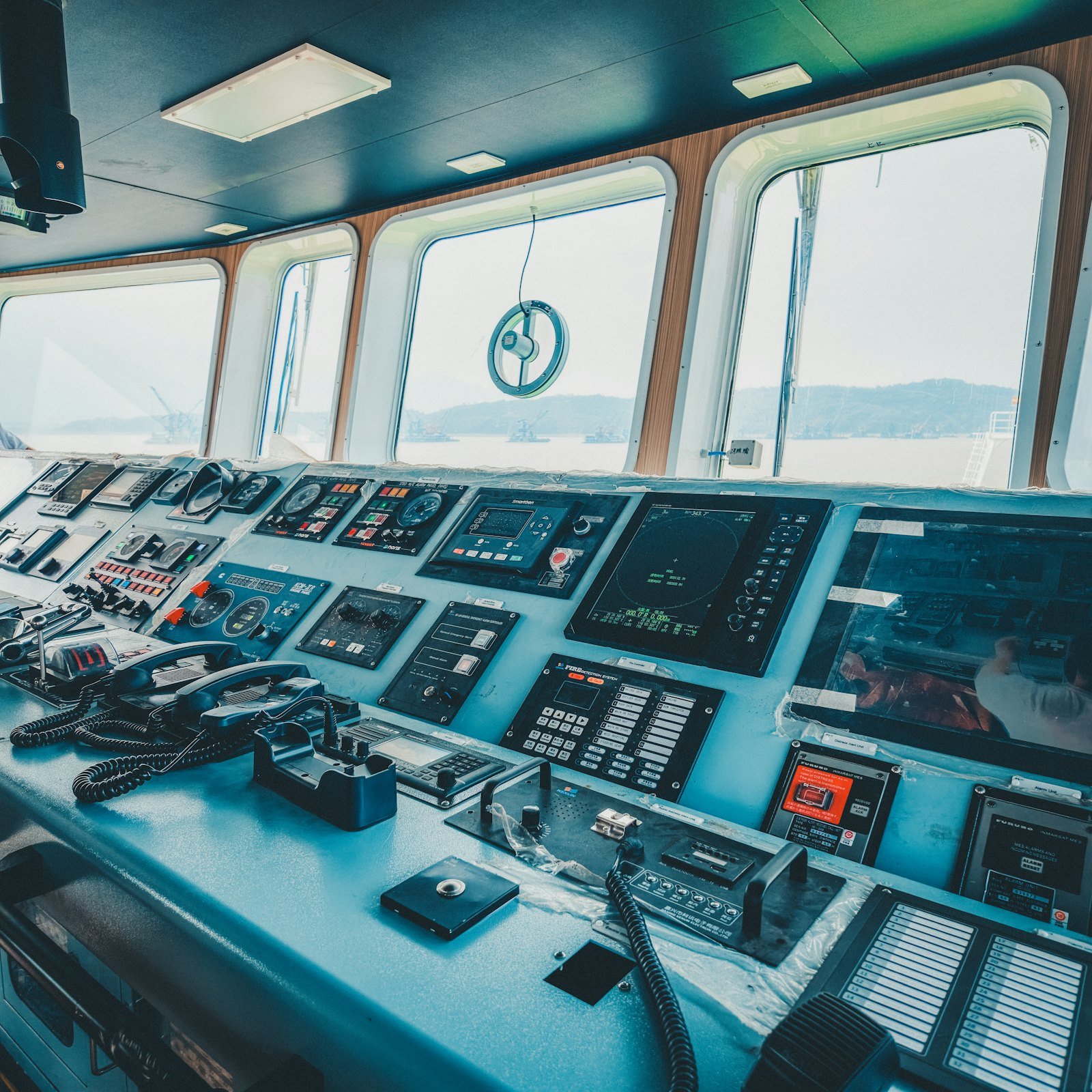 Ship bridge console with navigation screens